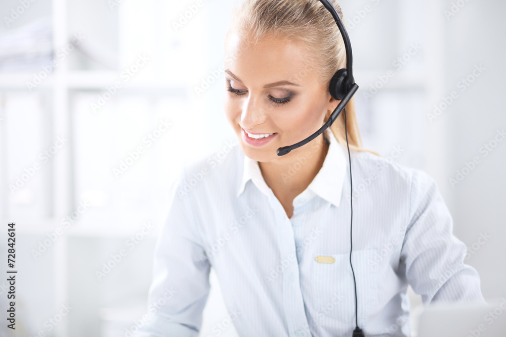 Close-up portrait of a customer service agent sitting at office Close-up portrait of a customer service agent sitting at office