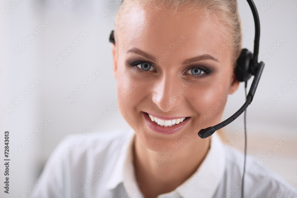 Close-up portrait of a customer service agent sitting at office Close-up portrait of a customer service agent sitting at office