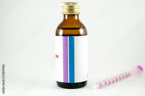 Wallpaper Mural Feeding syringe and medicine bottle Torontodigital.ca