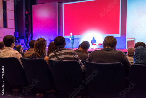 people sitting rear at the business conference