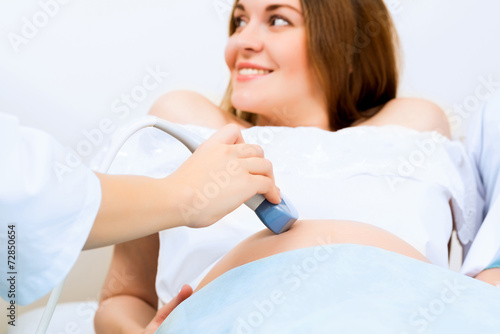 hands and abdominal ultrasound scanner