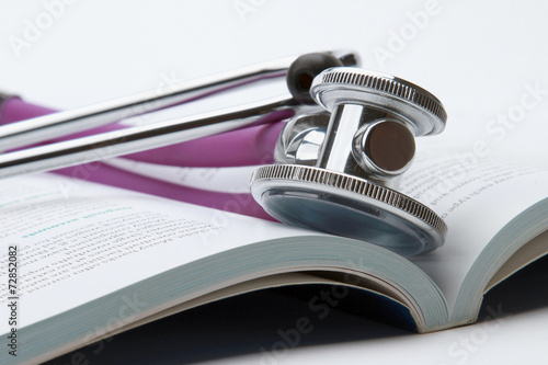 Wallpaper Mural A stethoscope on an open book Torontodigital.ca