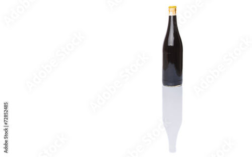A bottle of soy sauce over white background