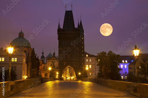 Photography Charles bridge at moonlit night. Prague, Czech Republic