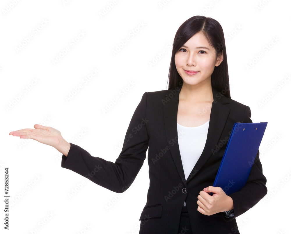 Asian businesswoman with clipboard and open hand palm Asian businesswoman with clipboard and open hand palm