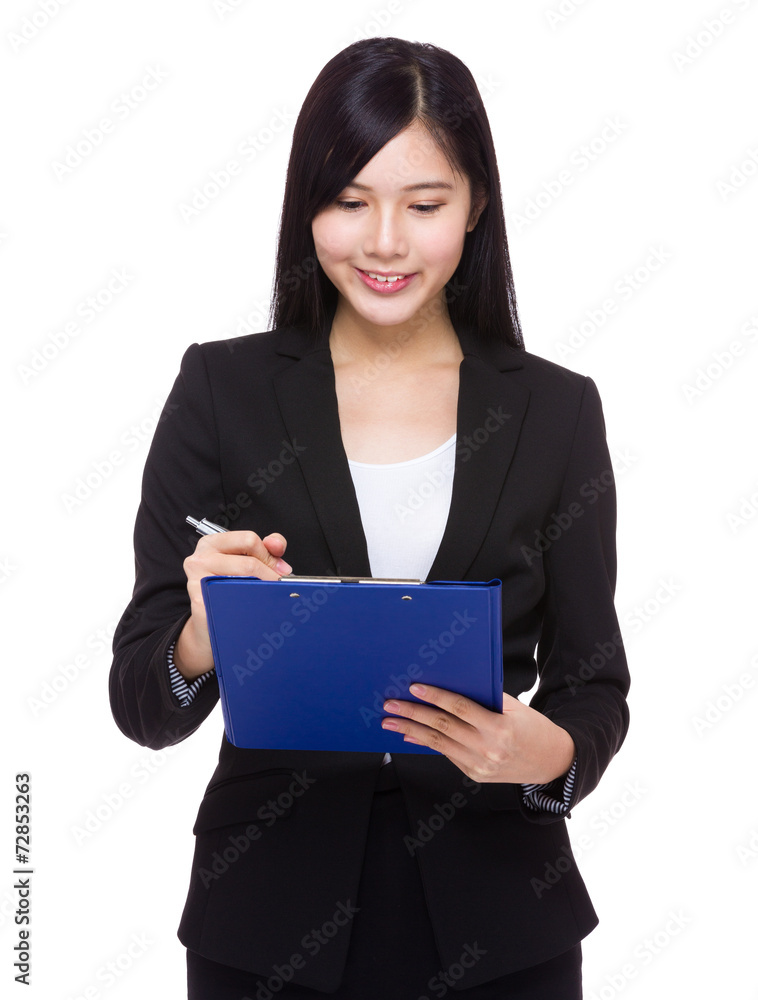 Businesswoman write on clipboard Businesswoman write on clipboard