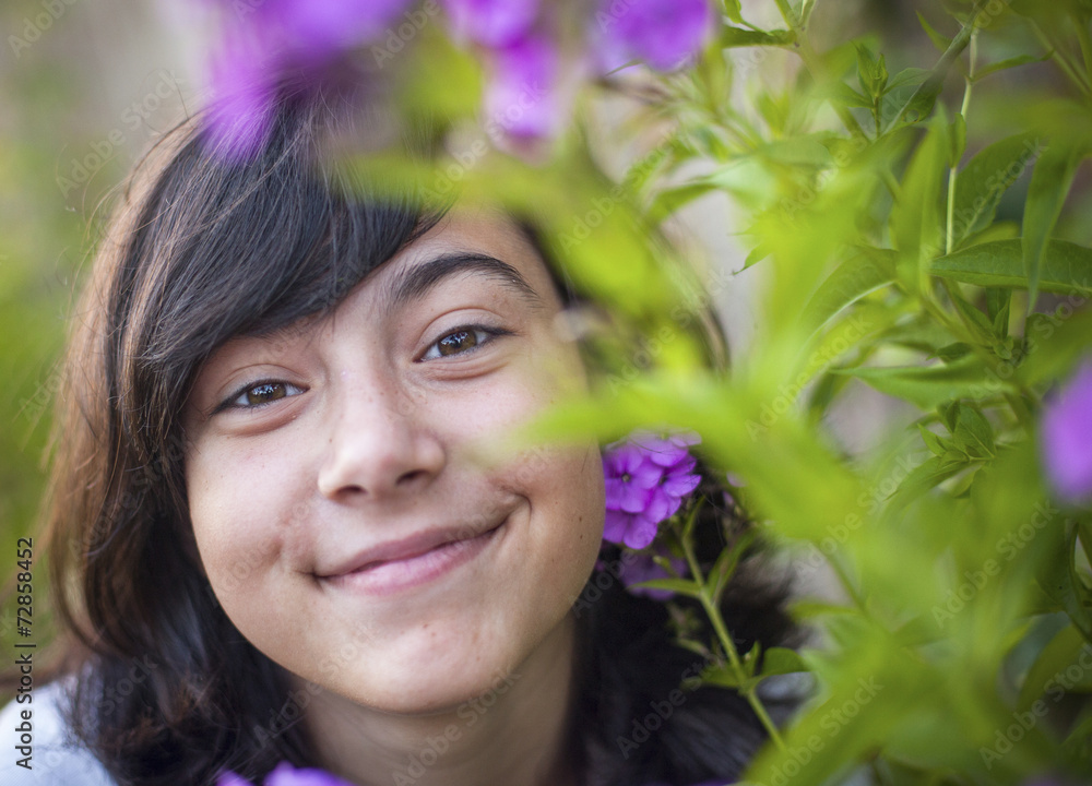 Portrait of a young sweet girl in the garden. Portrait of a young sweet girl in the garden.