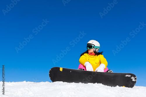 snowboarder sitting snow mountain slope copy space