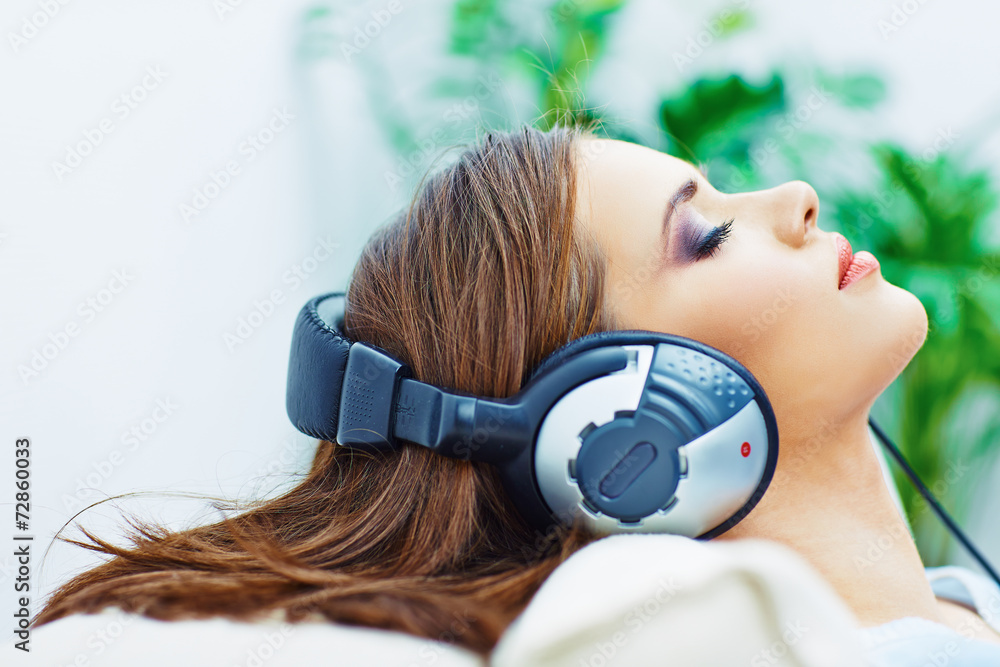 Young woman home portrait. Sleeping girl with headphones. Young woman home portrait. Sleeping girl with headphones.