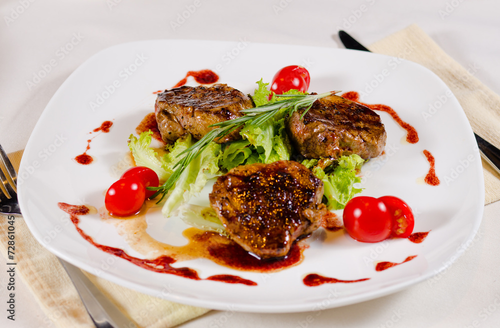 Grilled Meat Cuts with Veggies on White Plate Grilled Meat Cuts with Veggies on White Plate