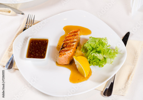 Plated Meal of Grilled Salmon with Sauce