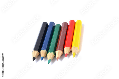 Assortment of colored pencils over white
