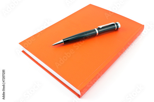 Pen on  red notebook isolated on white