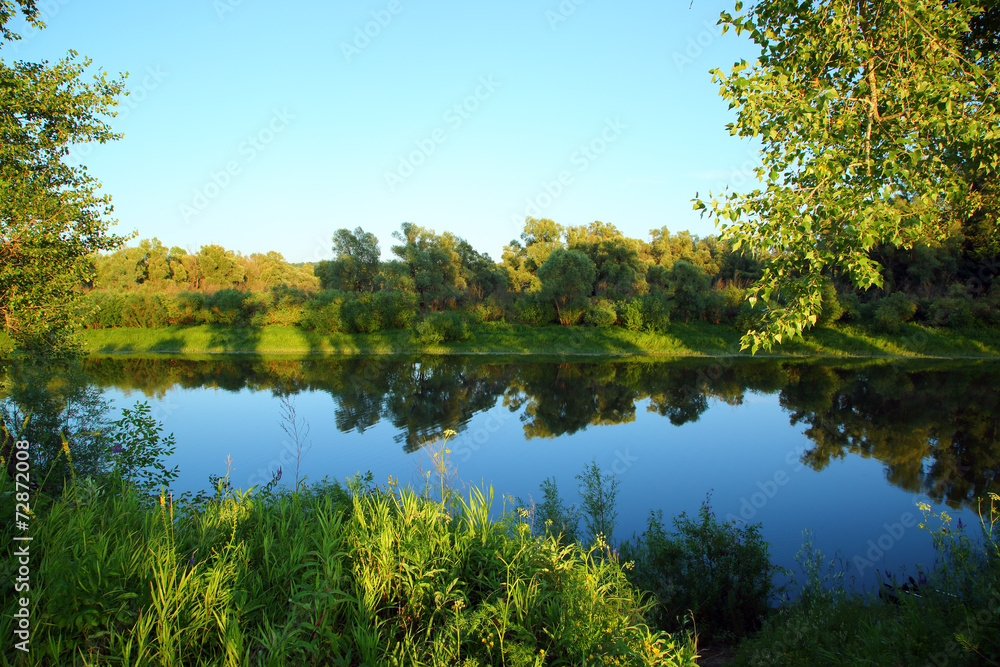 evening summer landscape with small river
