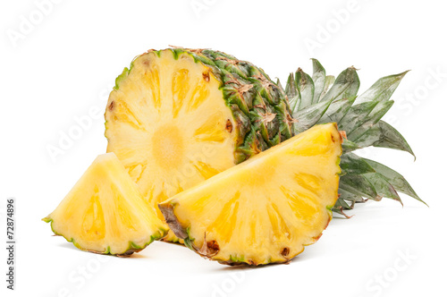 Half of pineapple and his slices isolated