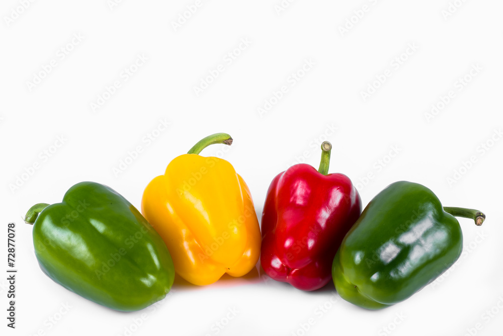green red and yellow peppers in a row green red and yellow peppers in a row
