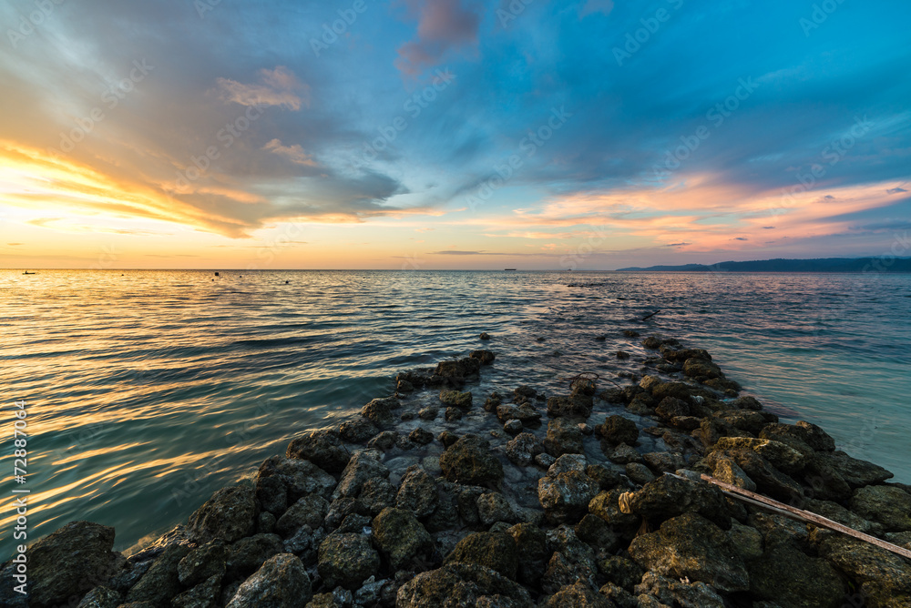 Stone waterbreak at sunset