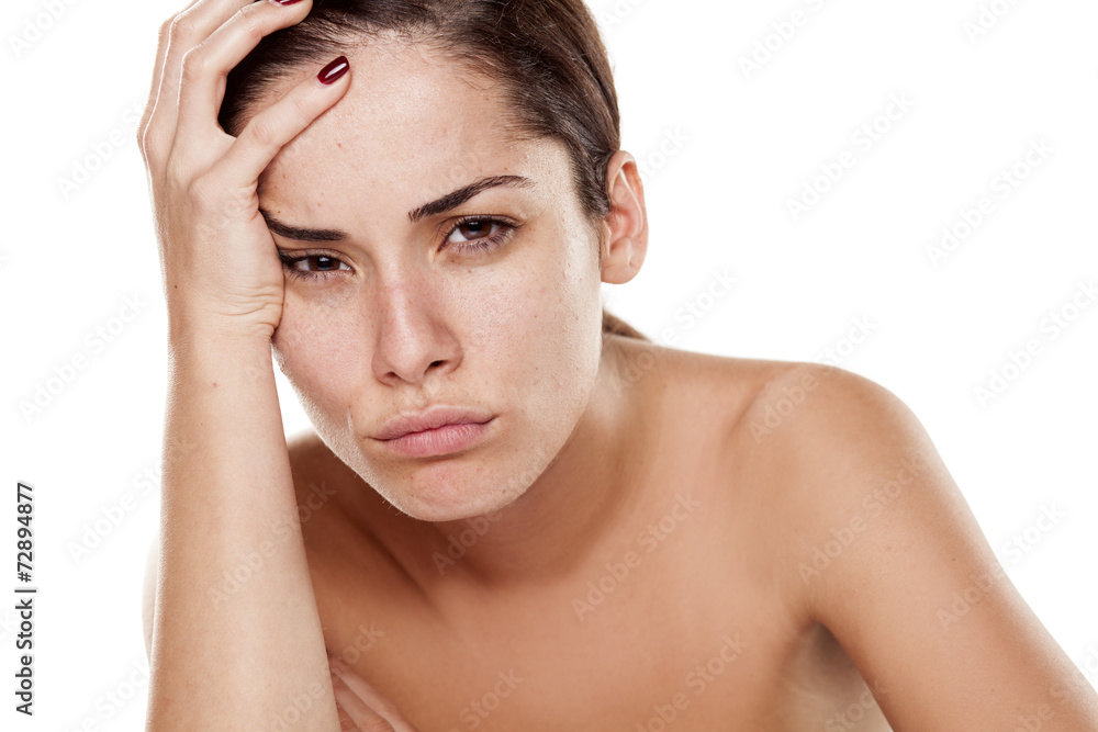 sad and disappointed young woman on a white background sad and disappointed young woman on a white background