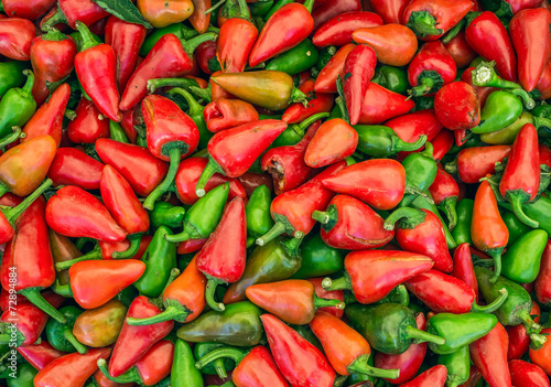 Small green and red paprika on a market stall