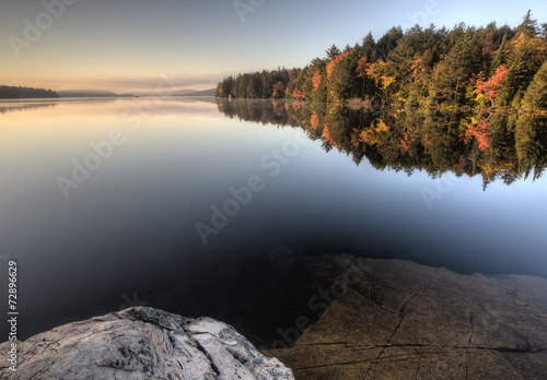 Lake in Autumn sunrise reflection