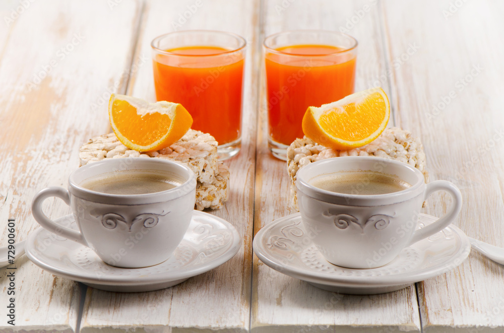 Healthy breakfast - two cup of coffee, orange juice Healthy breakfast - two cup of coffee, orange juice