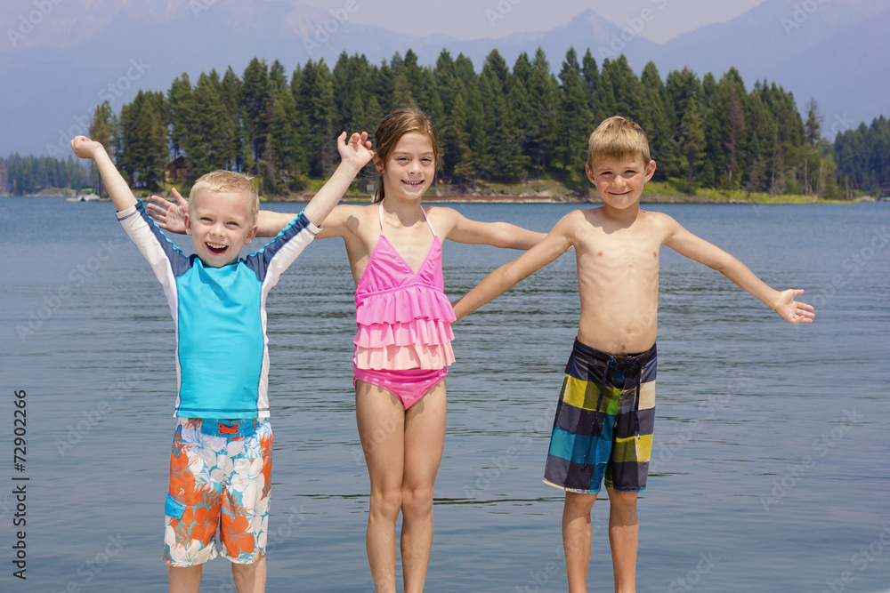 Kids enjoying summer vacation at the lake Kids enjoying summer vacation at the lake