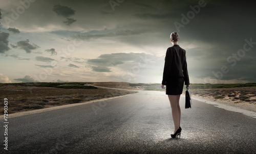 Businesswoman on road © Sergey Nivens