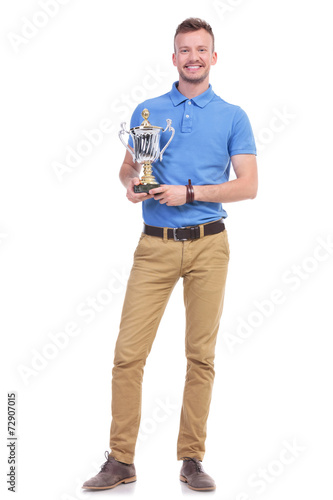 casual young man with a trophy