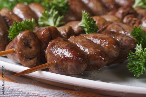 Grilled chicken hearts on skewers macro horizontal photo