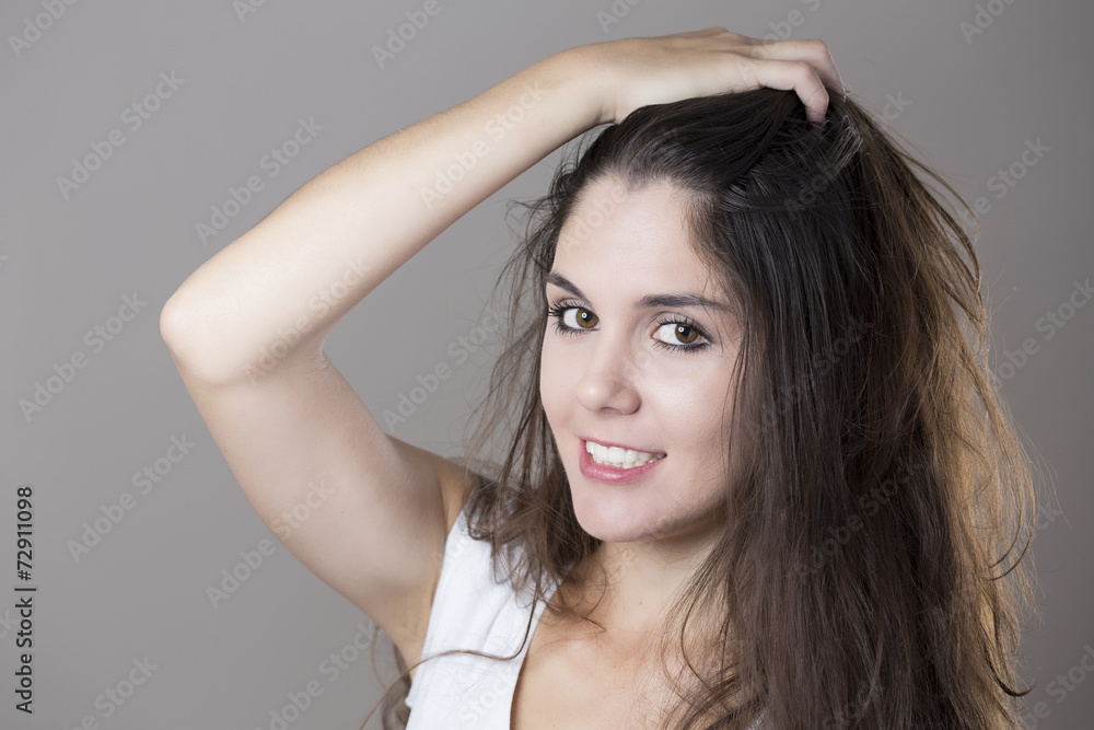 Portrait of a young brunette woman making faces with different e Portrait of a young brunette woman making faces with different e
