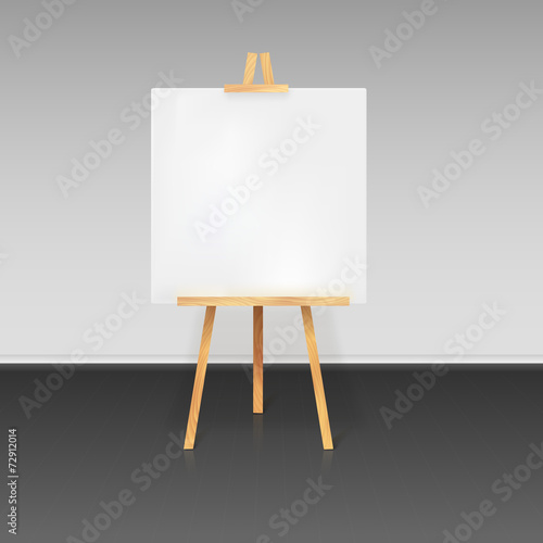 Wooden tripod with a white sheet of paper