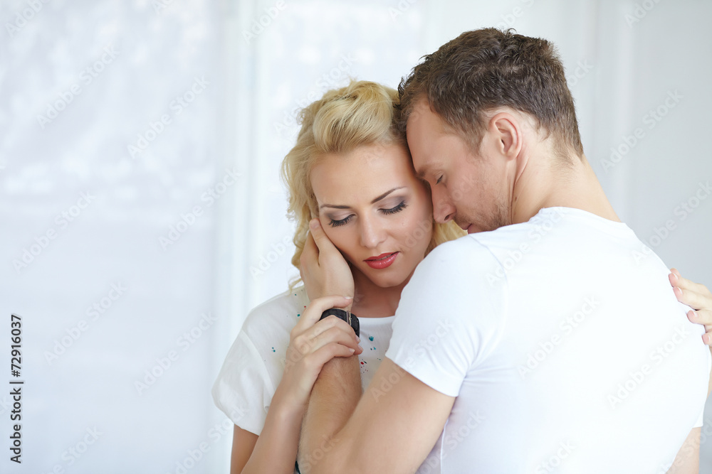 Fototapeta premium couple standing embracing