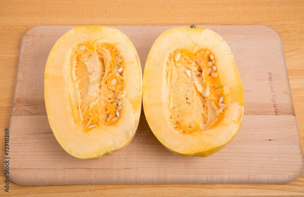 Halved Spaghetti Squash on Cutting Board Halved Spaghetti Squash on Cutting Board