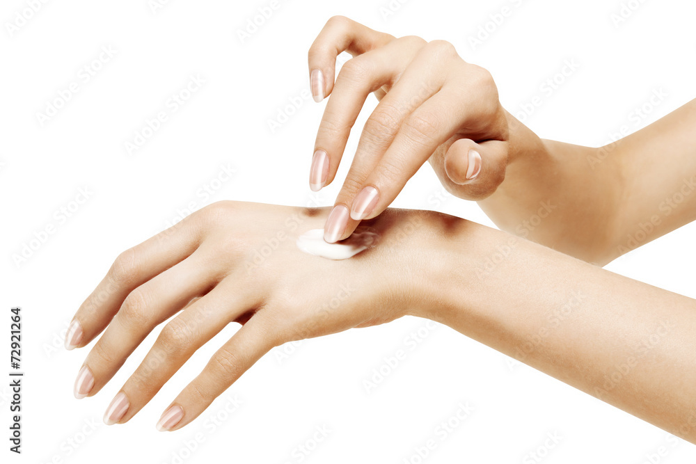 moisturizer cream on female hands on a white background moisturizer cream on female hands on a white background
