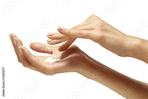 Moisturizer cream on beautiful female hands isolated photo