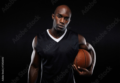 Muscular young basketball player