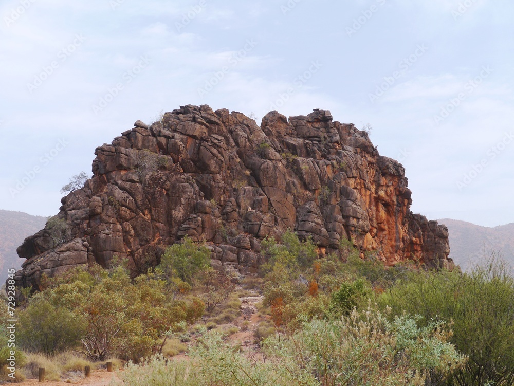 Corroboree Rock is an outstanding dark grey column of dolomite