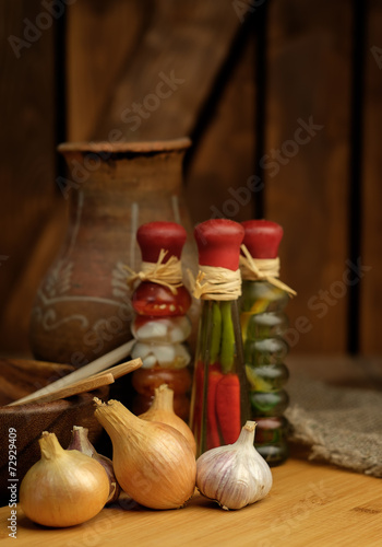Onions and garlic on a wooden table.