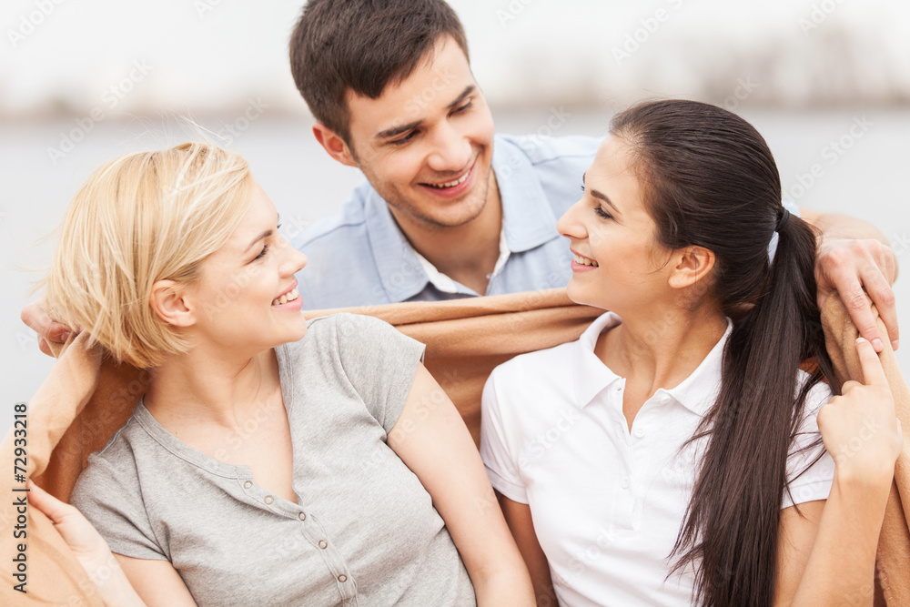 Attractive young women sitting on beach at summer. Attractive young women sitting on beach at summer.