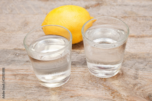 Two glasses of vodka and lemon photo