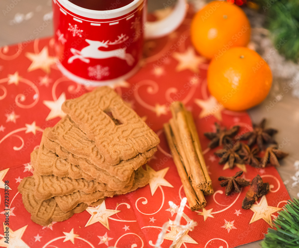 christmas tea with biscuits, cinnamon, anise stars and tangerine