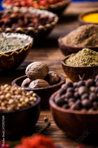 Colorful theme with spices on wooden table © oleksajewicz