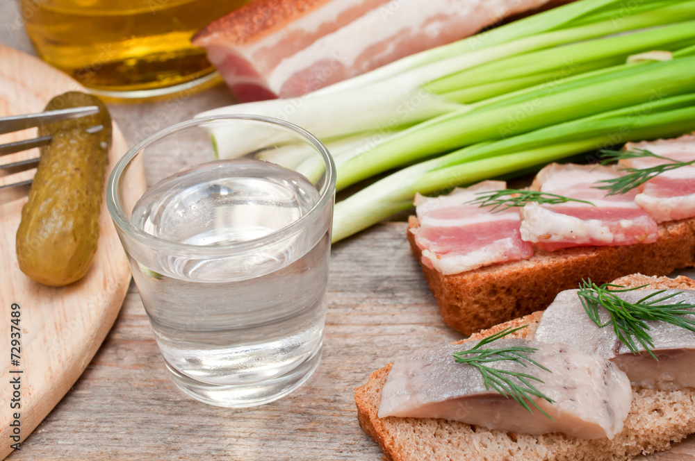 Vodka, green onion, cucumber and bacon sandwiches and herring Vodka, green onion, cucumber and bacon sandwiches and herring