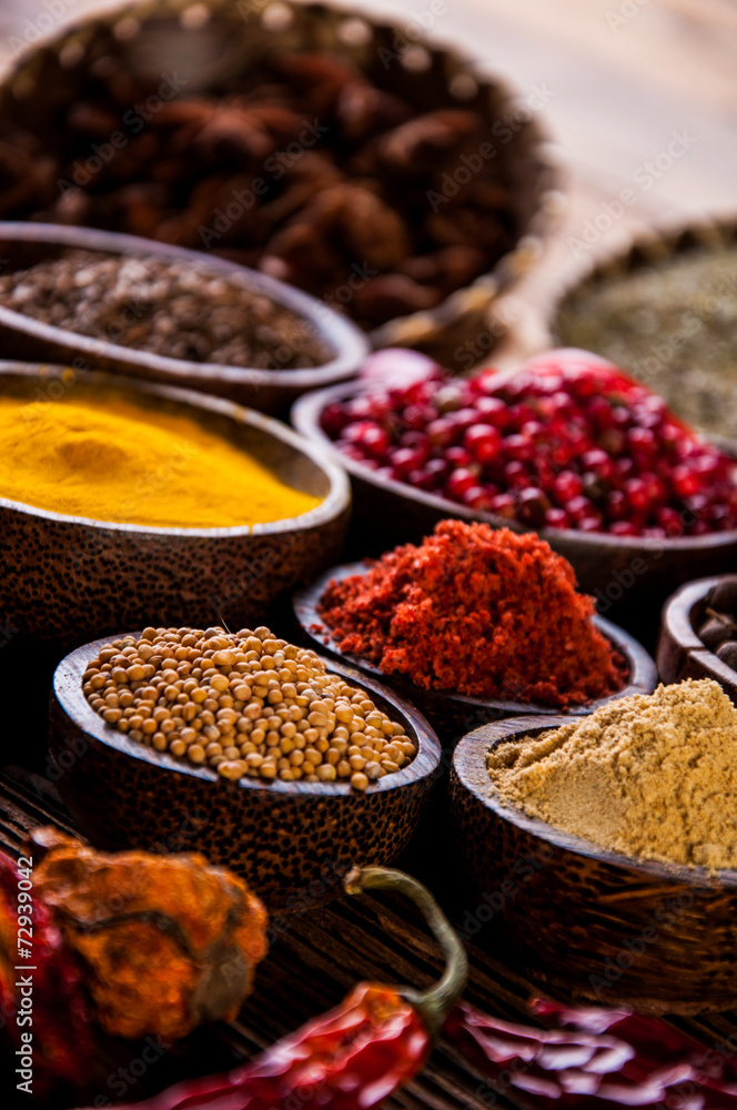 Oriental hot spices on wooden table Oriental hot spices on wooden table