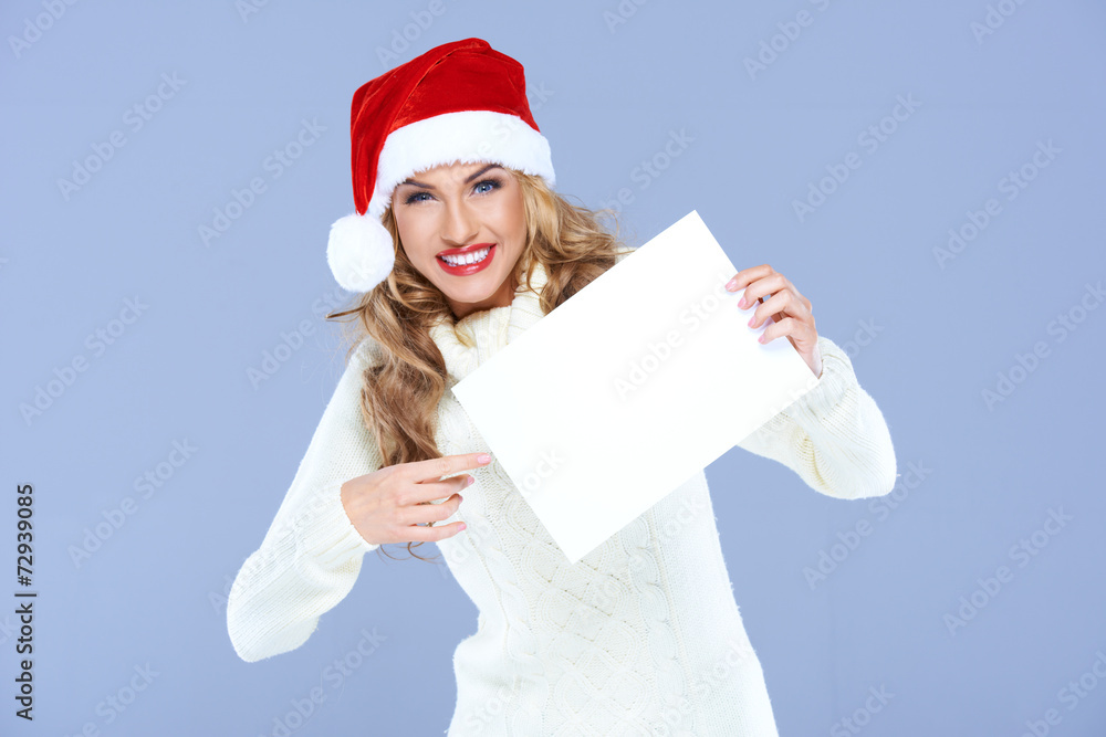 Vivacious woman in a red Santa hat Vivacious woman in a red Santa hat