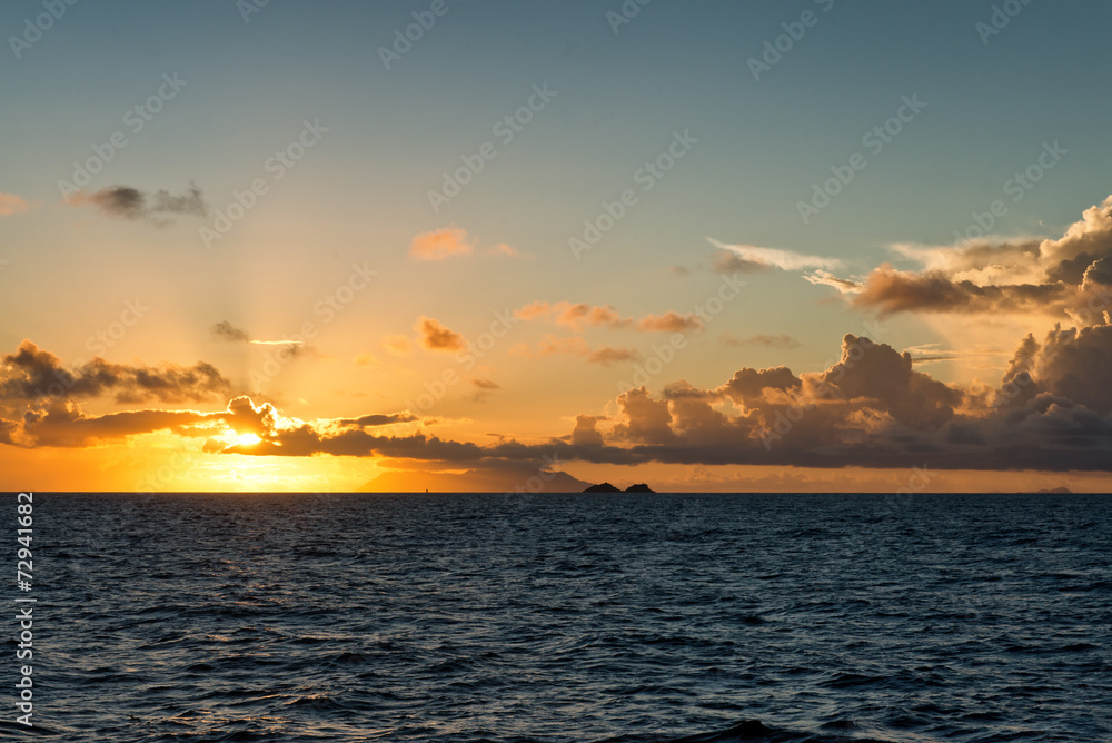 Colorful orange tropical ocean sunset