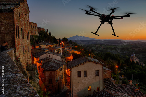 Flying drone in the sunset skies