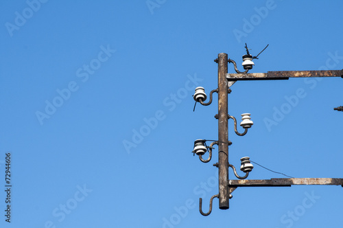 Disused isolators of street electric cables on metal frame