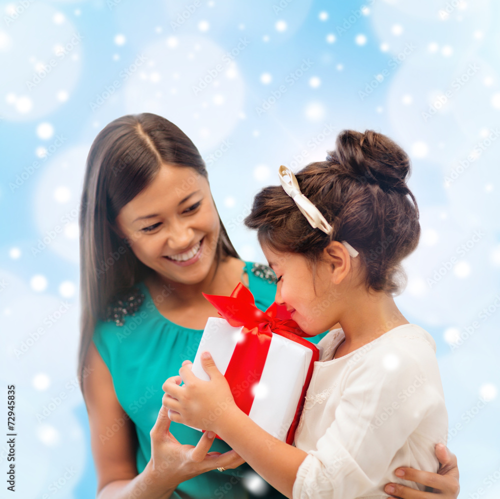 happy mother and child girl with gift box happy mother and child girl with gift box
