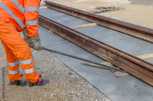 Fotografie Align piece of railroad track before welding